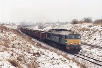 21.02.2002, na łuku 2 km za stacją Ełk, ST44-957 z transportem miału. TKMS 763 Ełk - Giżycko